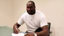 Nathan Jawai signs his contract