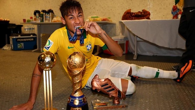 Neymar, with trophies.  PHOTO: FIFA.COM
