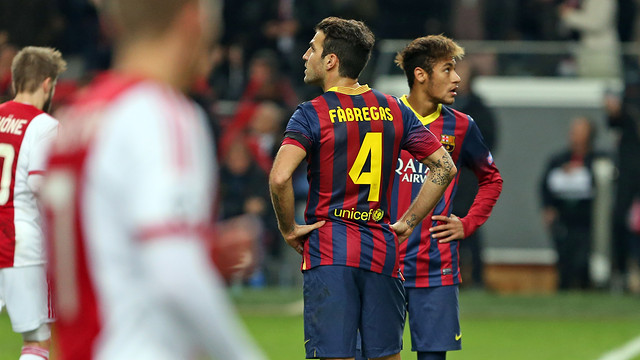 Cesc and Neymar stare upward in disbelief after Ajax score